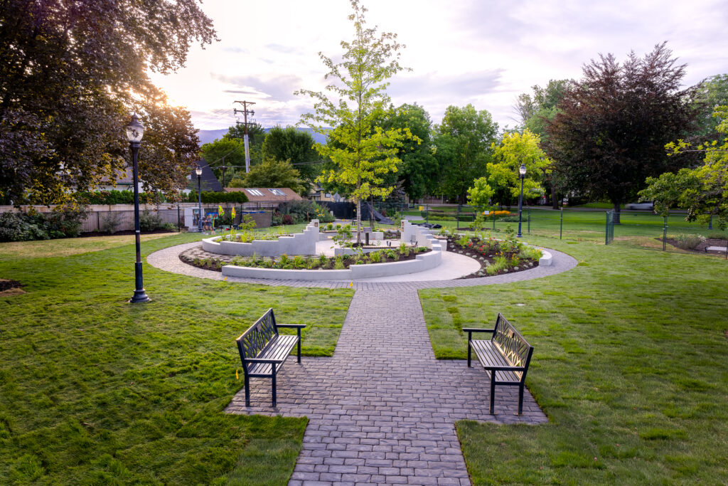 Lush Turf and Tree Installation Around Stone Features